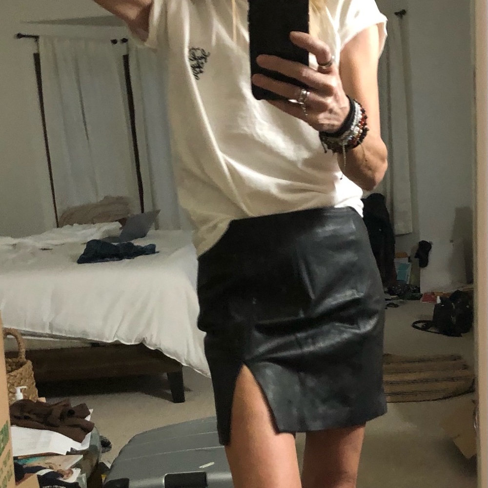 Simple black leather skirt with sexy little slit
